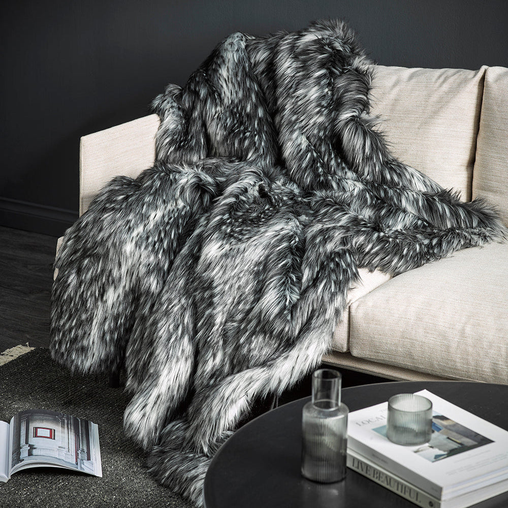 Alaskan wolf imitation fur throw over a cream sofa