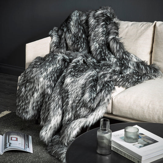 Alaskan wolf imitation fur throw over a cream sofa