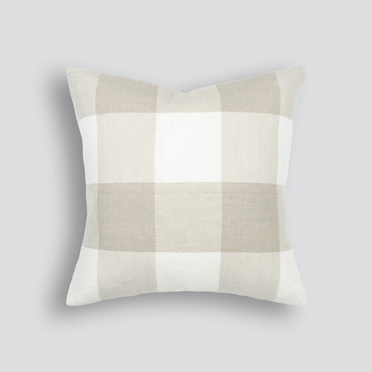 A beige and white checkered cushion with a handwoven, slight stonewash finish.