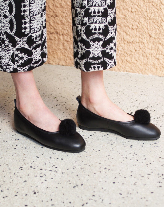 Italian Leather Ballet Slippers in black with a pom pom, wool lining and rubber sole. Luxury slippers from My Sanctuary