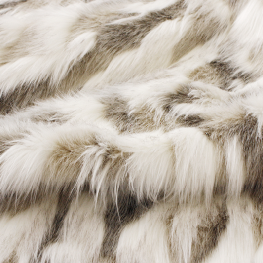 Luxury faux fur throw in cream and brown from Heirloom. These are the best fake fur throws, super soft for NZ interior design. Snowhare.