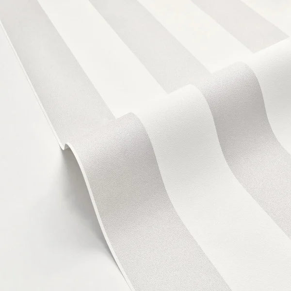 White textured wallpaper with a subtle vertical stripe pattern, shown in a close-up folded view.