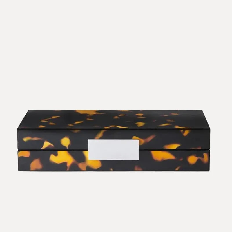 Black and orange tortoiseshell rectangular box on a white background