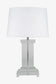 Table lamp with a white shade and clear base on a white background