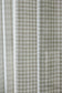 Close-up of a fabric with a plaid pattern in neutral colors.
