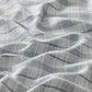 Close-up of textured fabric with wavy pattern