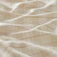 Close-up of beige fabric with subtle pattern
