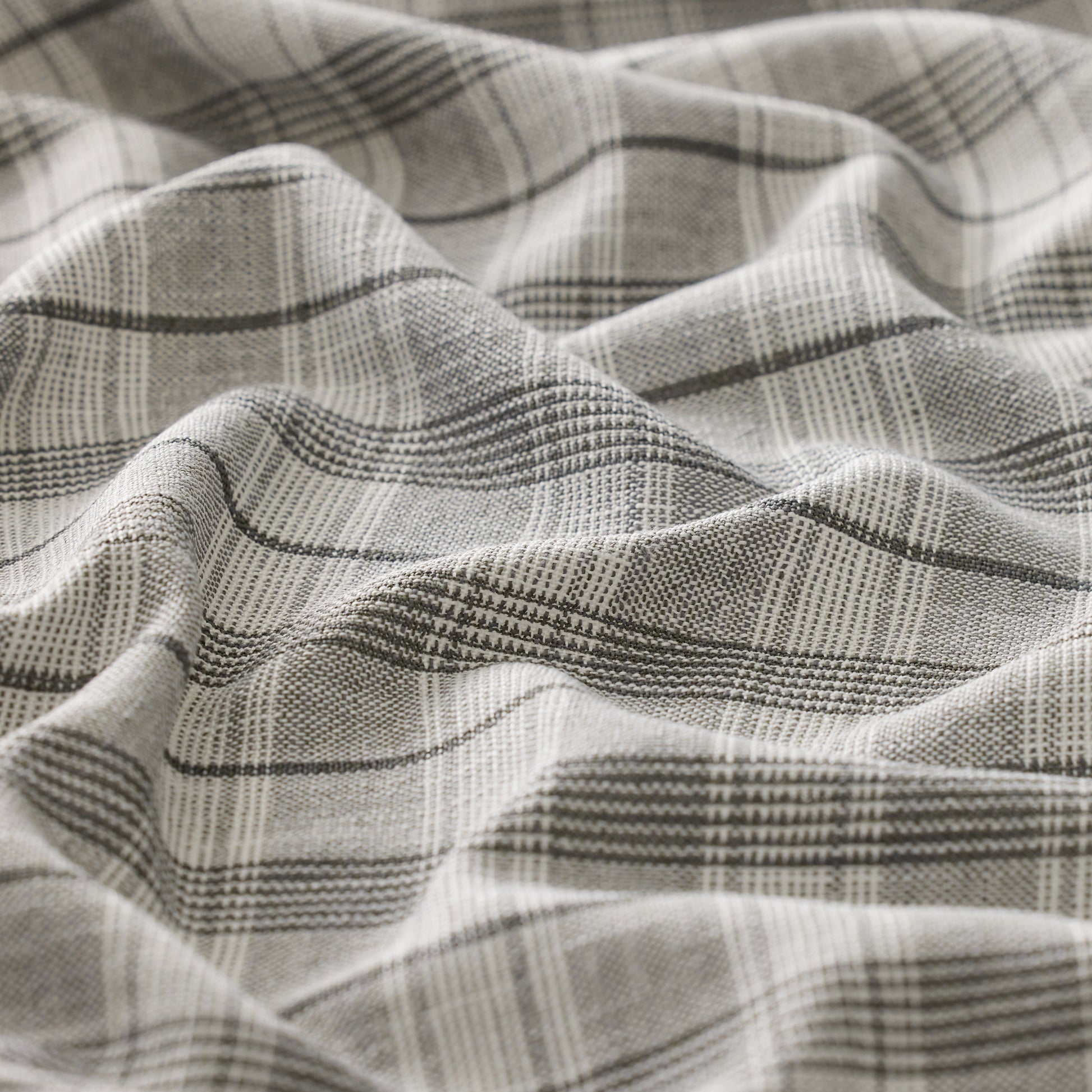 Close-up of textured fabric with a plaid pattern