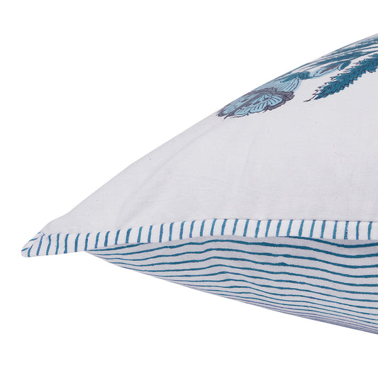 White pillow with blue decorative elements on a white background