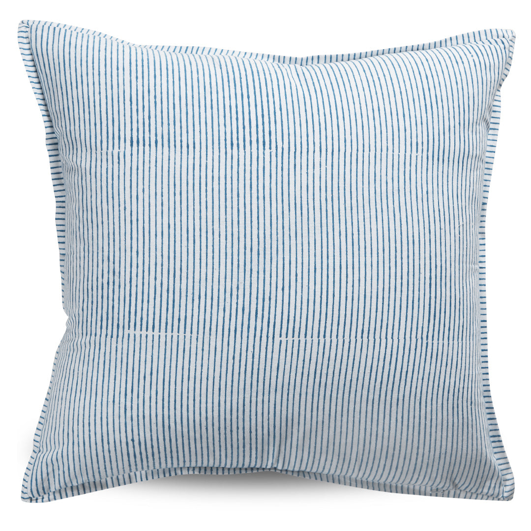 Blue and white striped pillow on a white background