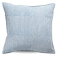 Blue and white striped pillow on a white background