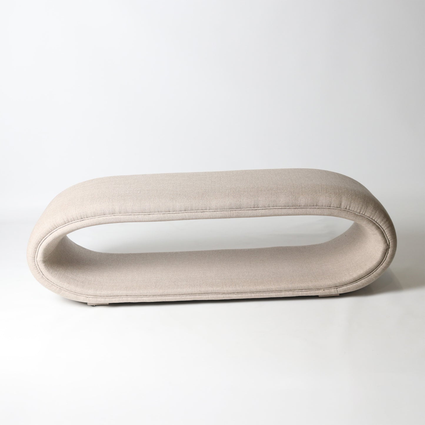 Open oval upholstered bench in cream