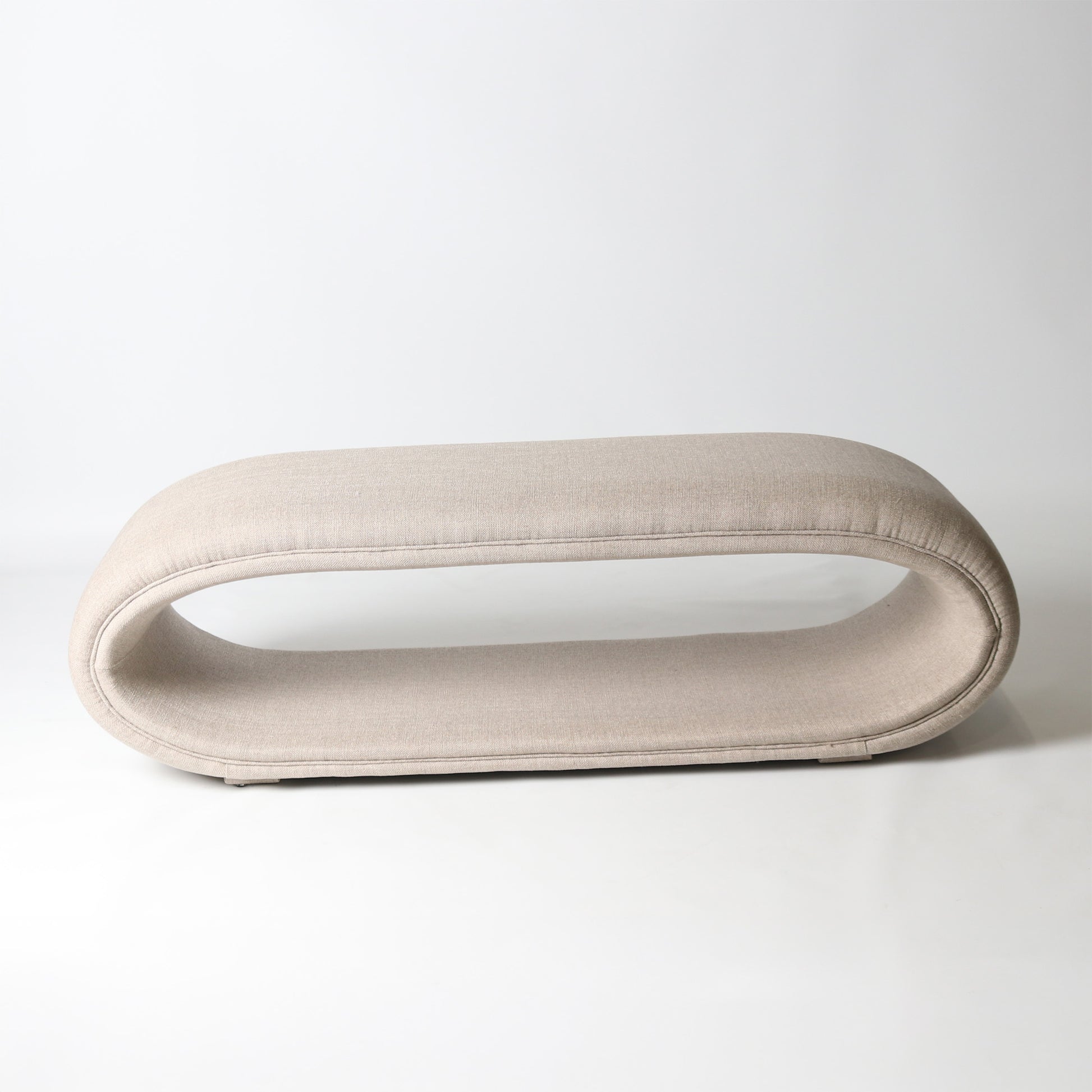 Open oval upholstered bench in cream