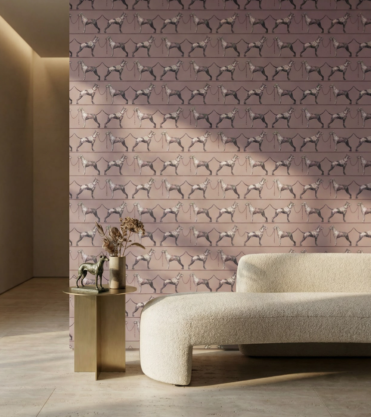 Living room with a patterned wall featuring dog illustrations and a beige sofa.