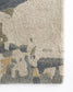 Close-up of a textured rug with a camouflage pattern in neutral colors.