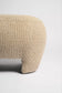 Beige textured ottoman on a white background