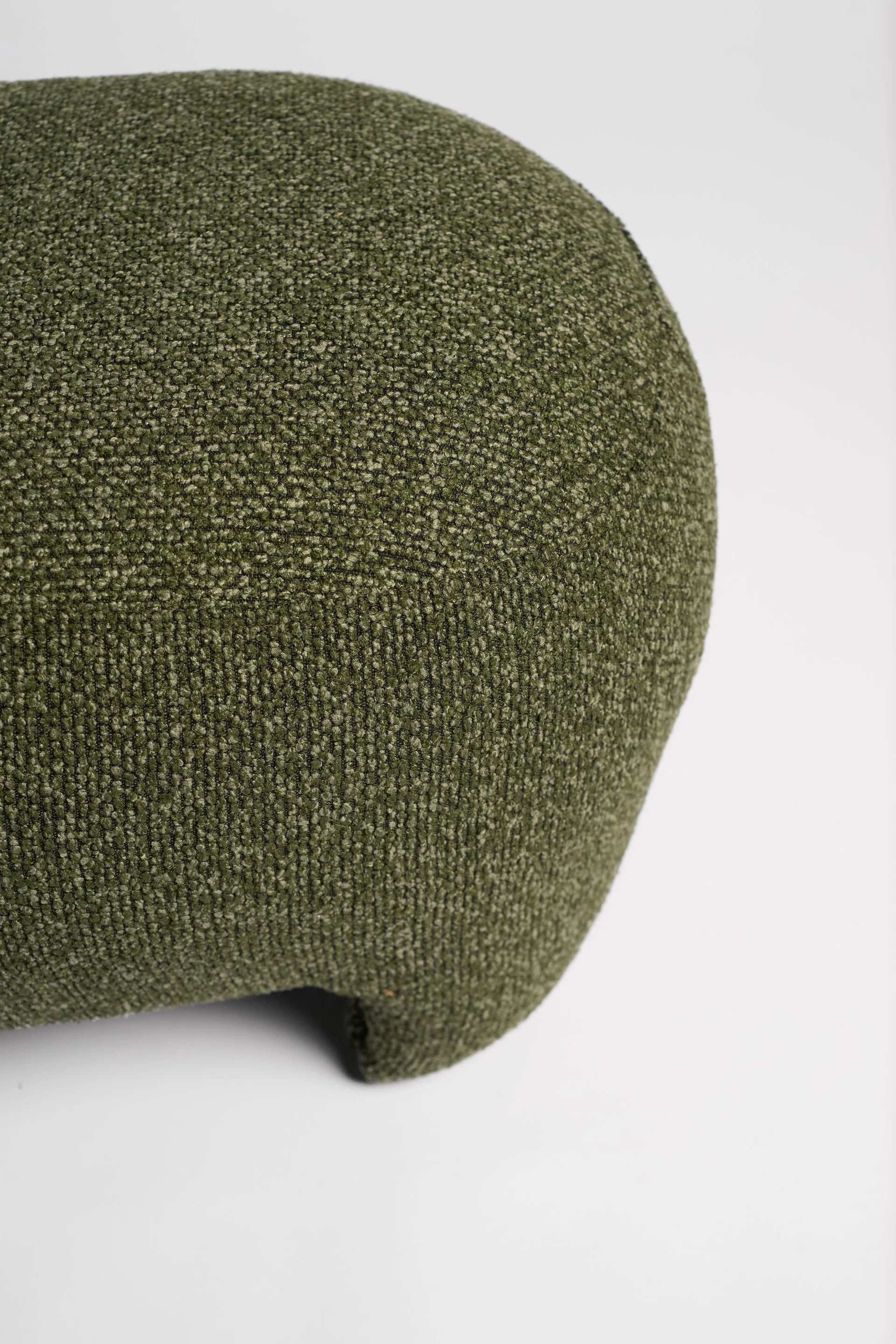 Green textured ottoman on a white background