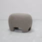 Gray textured ottoman on a white background