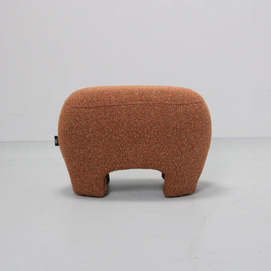 Brown textured ottoman on a light gray background