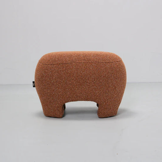 Brown textured ottoman on a light gray background