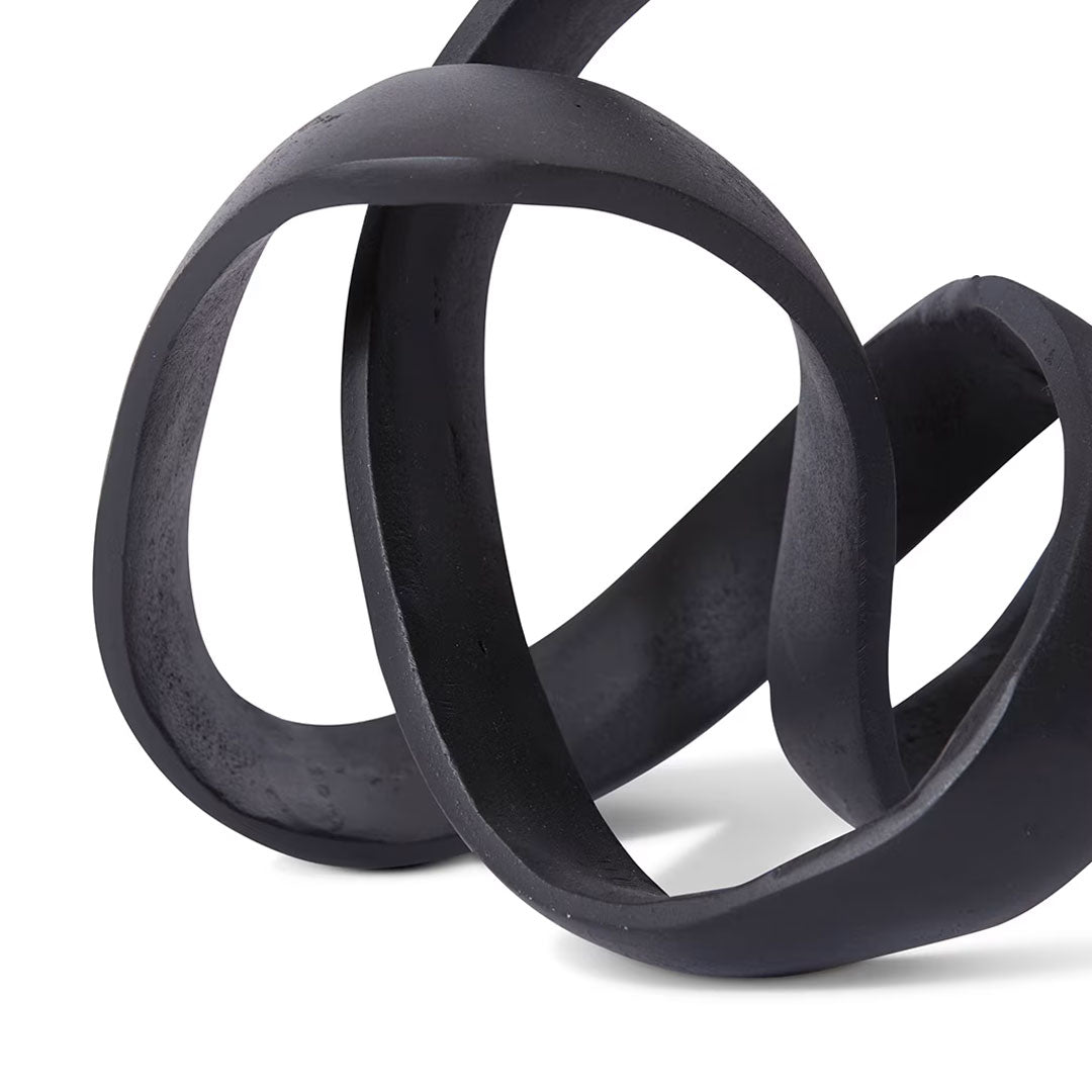 Black sculpture on a white background