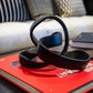 Black sculpture on a red book with a blurred background