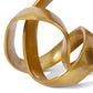 Gold abstract sculpture with interlocking rings on a white background