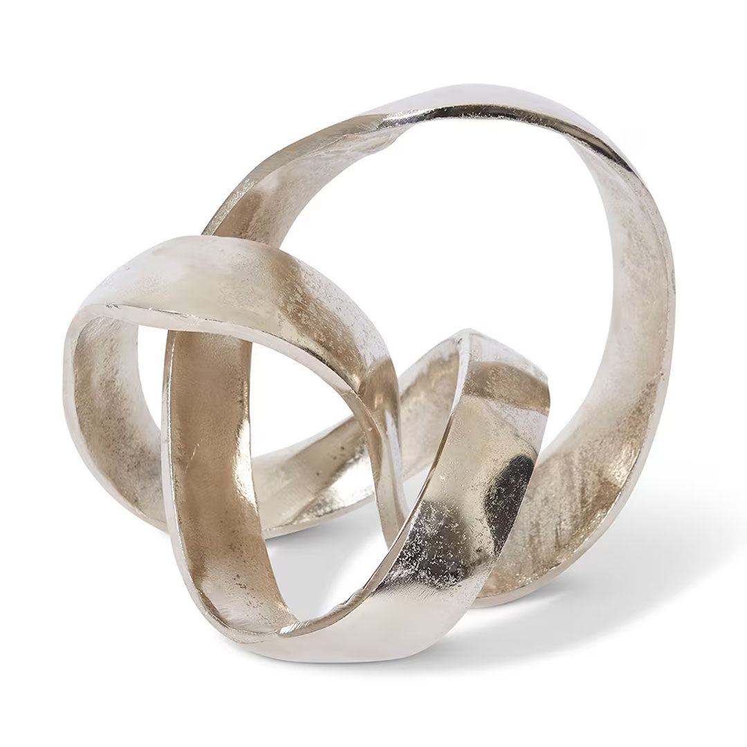 Silver interlocking rings on a white background