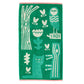 Green towel with white animal and nature-themed designs on a white background