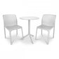White mesh chairs and table set on a white background