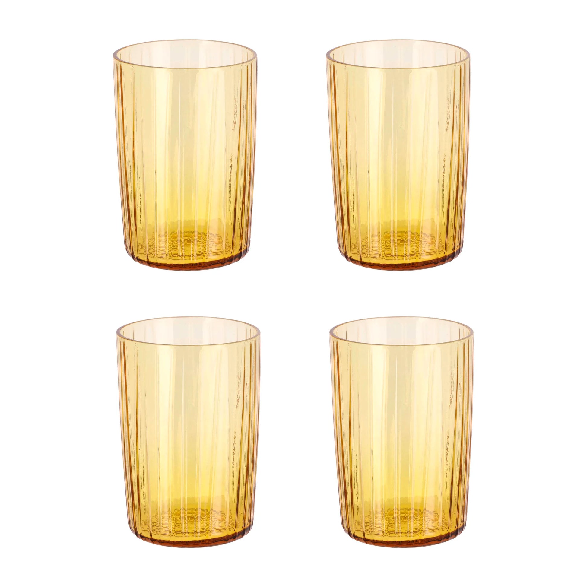 Four amber-colored glass tumblers on a white background
