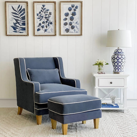 Blue armchair and ottoman in a living room with decorative elements.