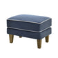 Blue ottoman with white piping on a white background
