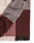 Plaid blanket with brown, gray, and pink colors on a white background