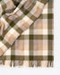 Plaid blanket with green and beige colors on a white background