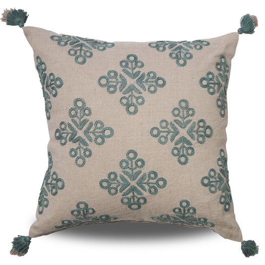 Natural coloured linen cushion with blue embroidered motifs and tassels on each corner
