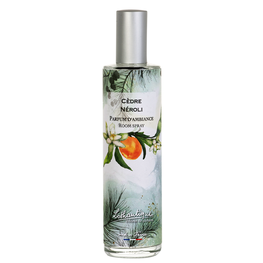 Room spray bottle with a label featuring an orange and green design on a white background