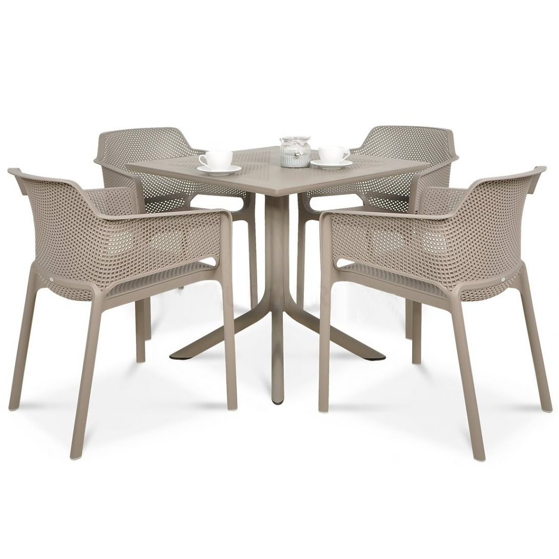 Outdoor dining set with a round table and four chairs on a white background