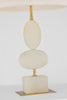 Decorative lamp with stacked beige alabaster spheres and gold accents on a white background