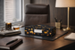 Decorative box on a desk with office supplies and a lamp in the background