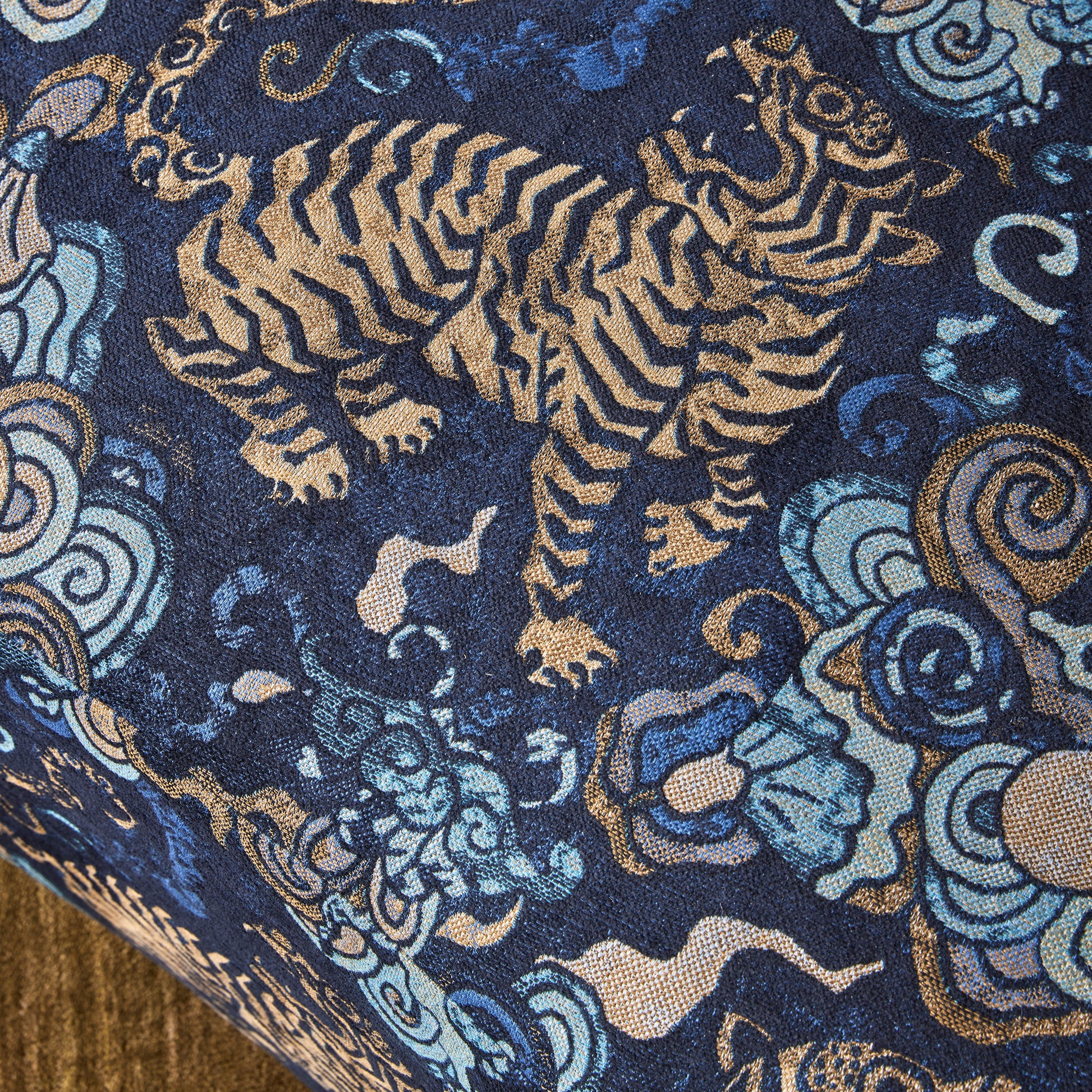 Decorative fabric with tiger and cloud pattern on a blue background
