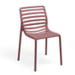 Pink chair with slatted design on a white background