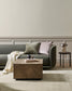 Modern living room with a gray sofa, wooden coffee table, and side table.