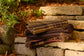 Plaid blanket on stone steps with natural background