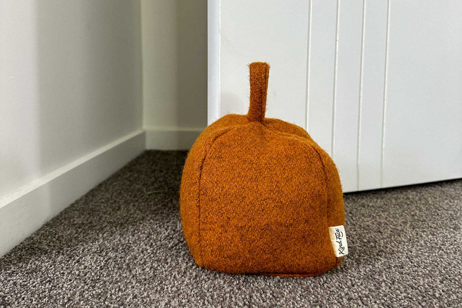 Orange wool doorstop