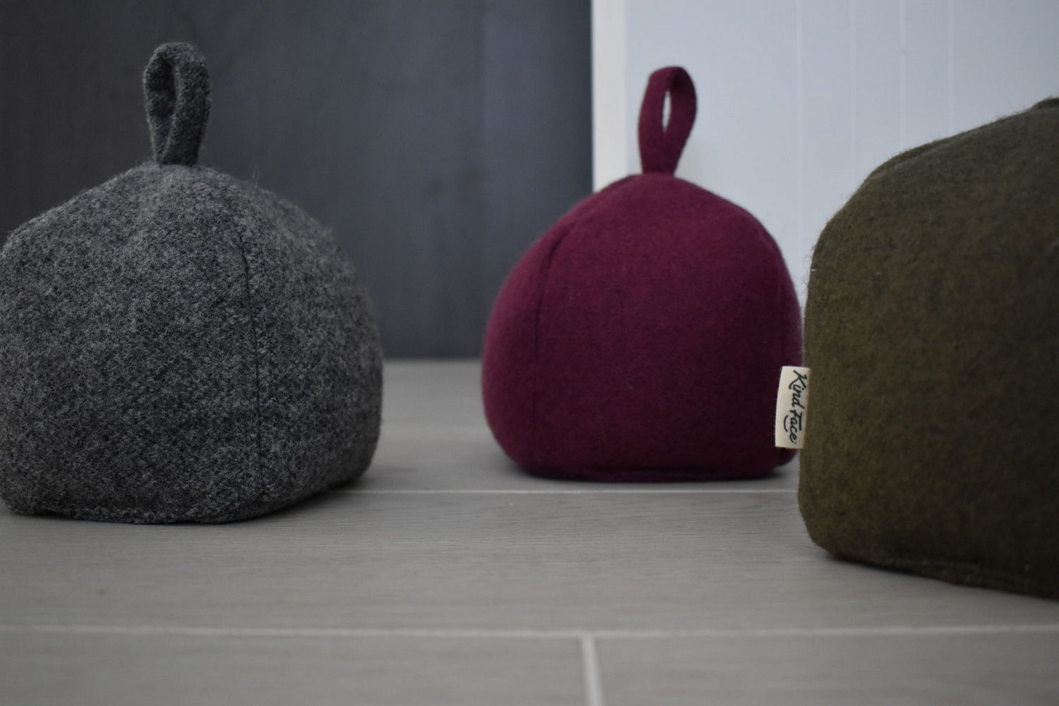 grey, burgundy and green pumpkin shaped wool doorstops