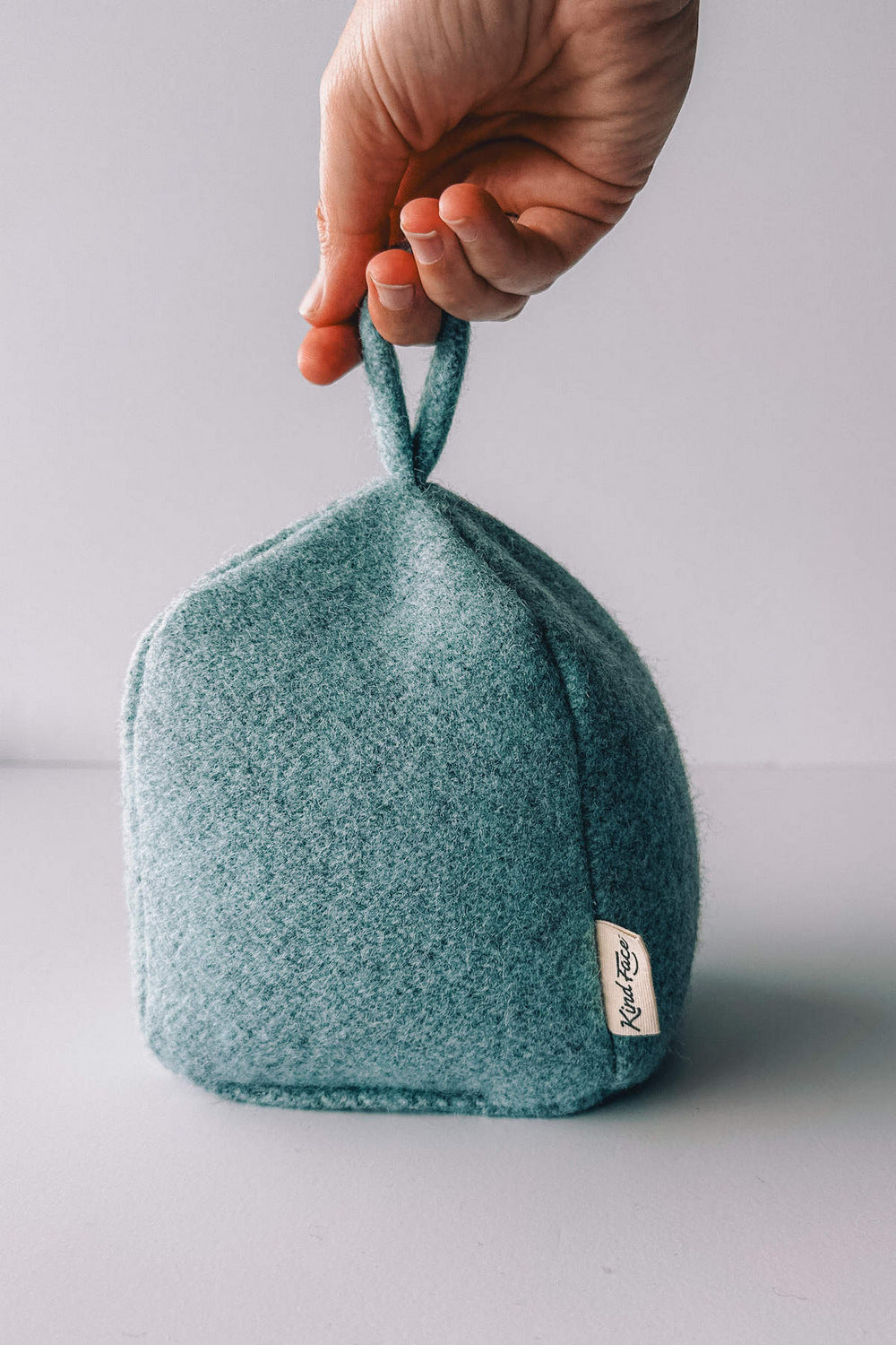Pale blue felted wool doorstop
