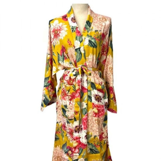 yellow kimono robe with large colourful flowers on a mannequin 