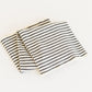Striped fabric with black and white lines on a light background