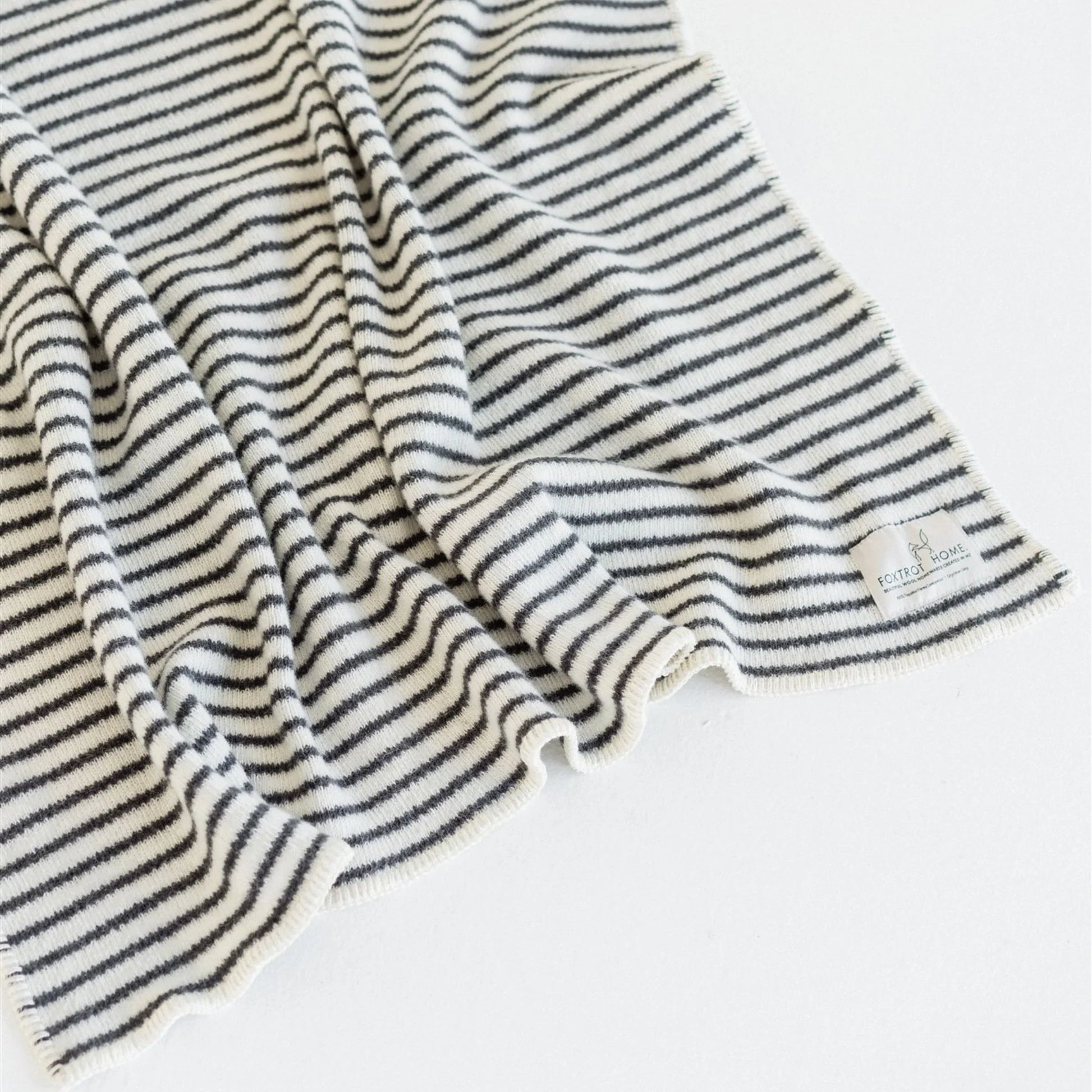 Striped fabric with a brand label on a white background